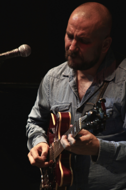 Juan Jose Lopez holding a guitar